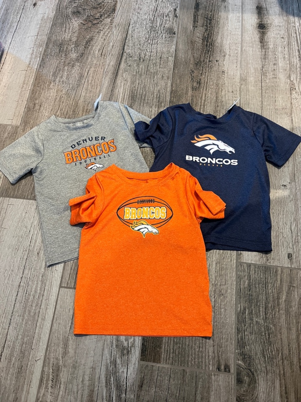 Denver Broncos child’s 4T dri-fit tees.